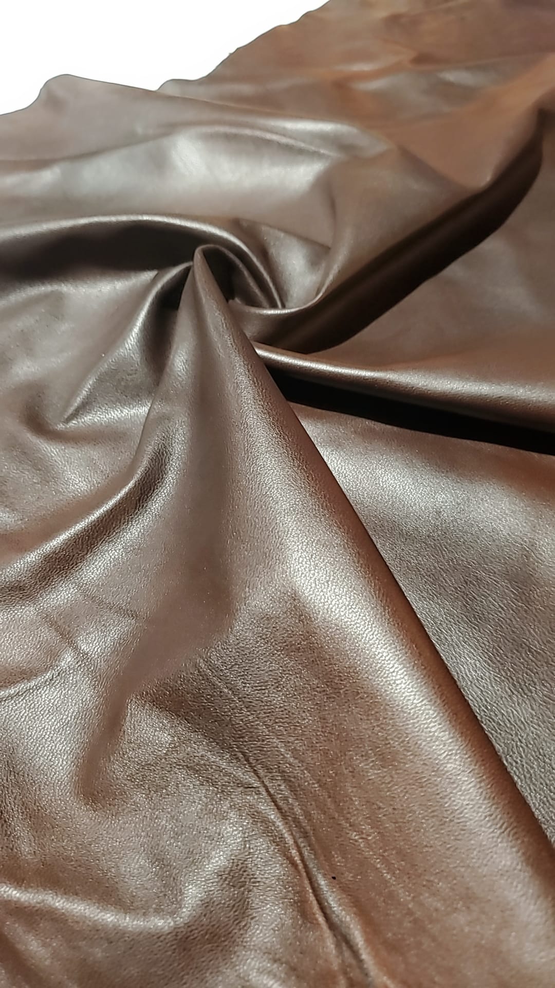 Brown leather hide beautifully contrasted with black details.
